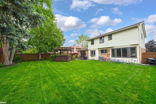 39067 Baroque Blvd, Clinton Township, MI 48038 - back of property with a pergola, brick siding, and central AC