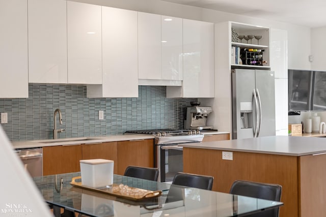 2638 John R St, Detroit, MI 48201 - kitchen with appliances with stainless steel finishes, modern cabinets, and tasteful backsplash