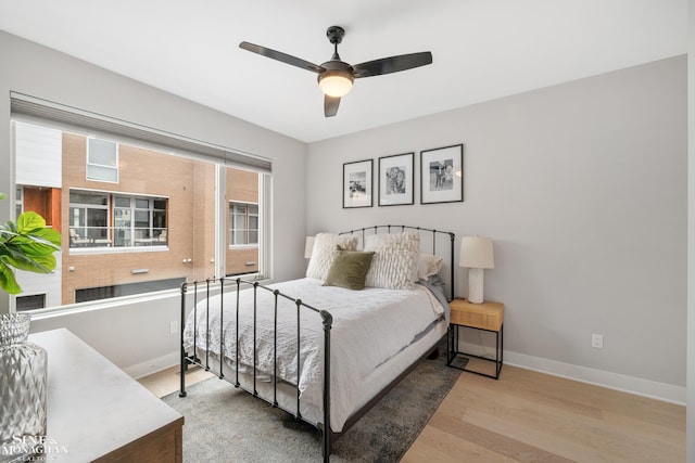 2638 John R St, Detroit, MI 48201 - bedroom with baseboards, wood finished floors, and a ceiling fan