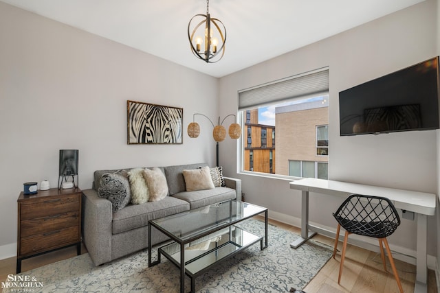 2638 John R St, Detroit, MI 48201 - living room featuring a chandelier, baseboards, and wood finished floors