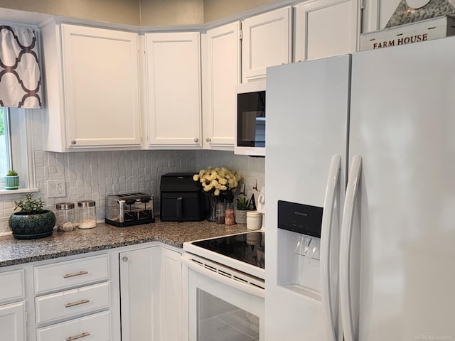 24725 Orchid St, Harrison Twp, MI 48045 - kitchen featuring white appliances, white cabinetry, decorative backsplash, and dark stone counters