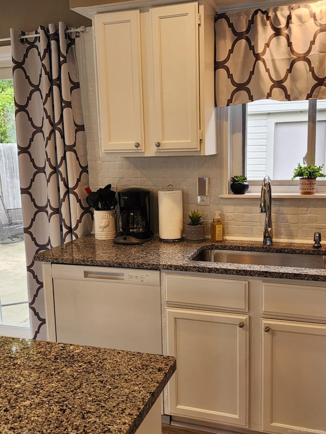 24725 Orchid St, Harrison Twp, MI 48045 - kitchen featuring a sink, backsplash, dark stone counters, white cabinets, and white dishwasher