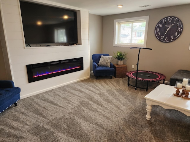 24725 Orchid St, Harrison Twp, MI 48045 - living area with a large fireplace, carpet flooring, and baseboards
