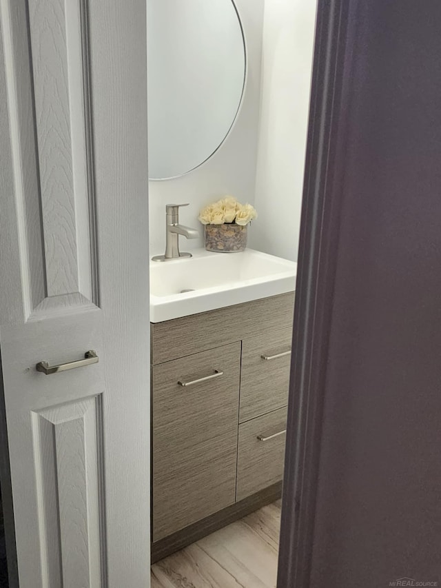 24725 Orchid St, Harrison Twp, MI 48045 - bathroom with vanity and wood finished floors