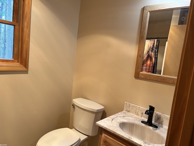 5077 Henry Hwy, Lewiston, MI 49756 - full bath featuring toilet, vanity, and a shower with shower curtain