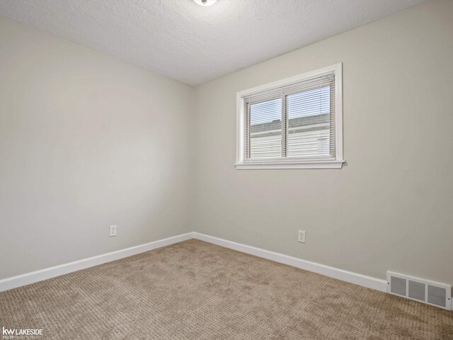 3422 S Annabelle St, Detroit, MI 48217 - carpeted spare room featuring baseboards and a textured ceiling