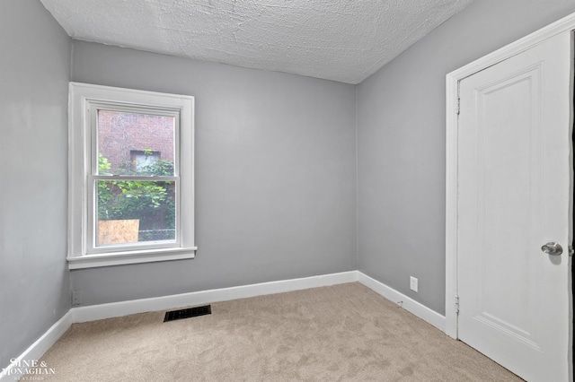 5553 Nottingham Rd, Detroit, MI 48224 - carpeted empty room featuring baseboards and a textured ceiling