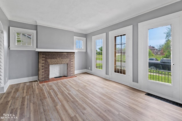 5553 Nottingham Rd, Detroit, MI 48224 - unfurnished living room with a fireplace, wood finished floors, baseboards, and ornamental molding
