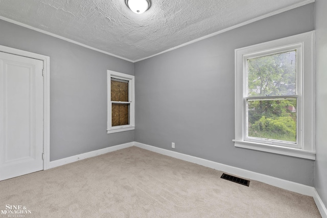 5553 Nottingham Rd, Detroit, MI 48224 - carpeted spare room with ornamental molding, a textured ceiling, and baseboards