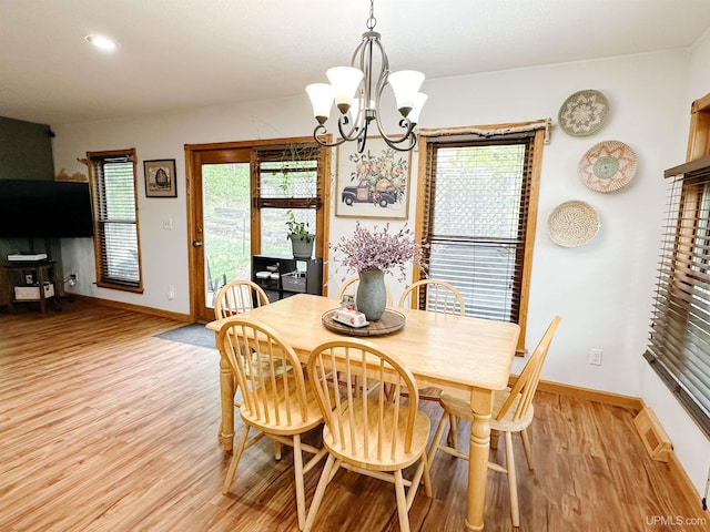 213 W Arch St, Negaunee, MI 49866 - dining area with baseboards, a chandelier, light wood-type flooring, and recessed lighting