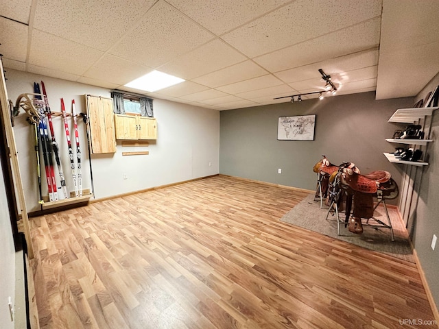 213 W Arch St, Negaunee, MI 49866 - finished basement with wood finished floors, a drop ceiling, and baseboards