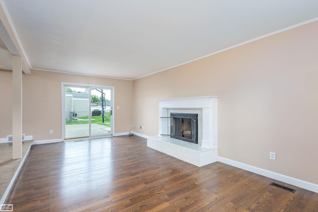 33519 Groth Ave, Sterling Heights, MI 48312 - unfurnished living room with wood finished floors, ornamental molding, a brick fireplace, and baseboards