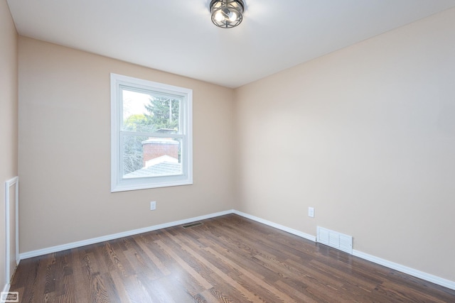 33519 Groth Ave, Sterling Heights, MI 48312 - unfurnished room featuring dark wood-style floors and baseboards