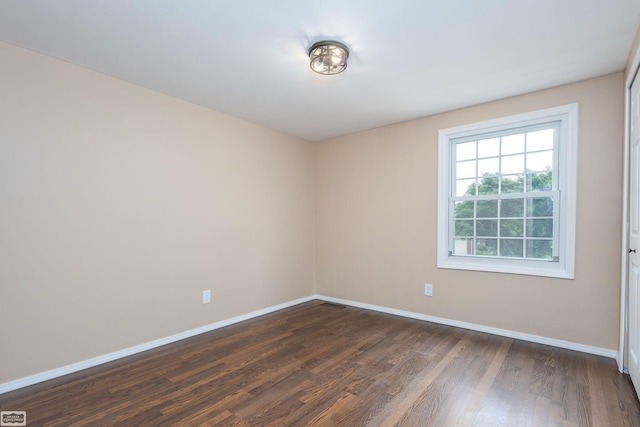 33519 Groth Ave, Sterling Heights, MI 48312 - spare room featuring dark wood finished floors and baseboards