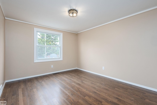33519 Groth Ave, Sterling Heights, MI 48312 - spare room featuring wood finished floors, baseboards, and crown molding