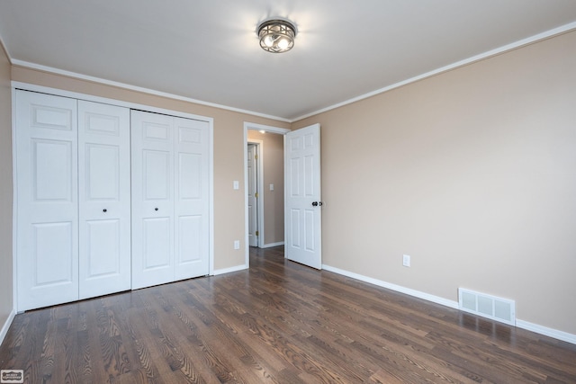 33519 Groth Ave, Sterling Heights, MI 48312 - unfurnished bedroom with dark wood-style floors, baseboards, a closet, and ornamental molding