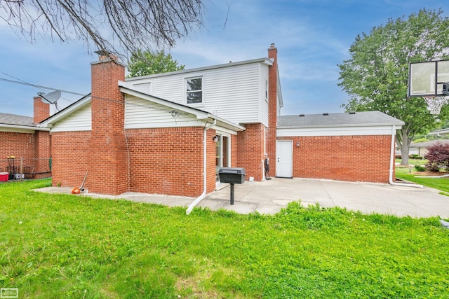 33519 Groth Ave, Sterling Heights, MI 48312 - back of house with a chimney, brick siding, a patio, and a lawn