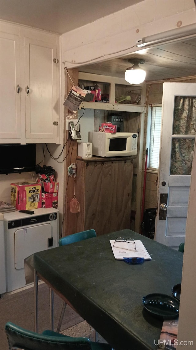 113 Paint Lake Loop, Iron River, MI 49935 - kitchen featuring white cabinetry, white microwave, and open shelves