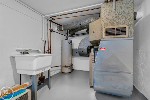 1011 Garfield St, Port Huron, MI 48060 - unfinished below grade area with water heater and a sink