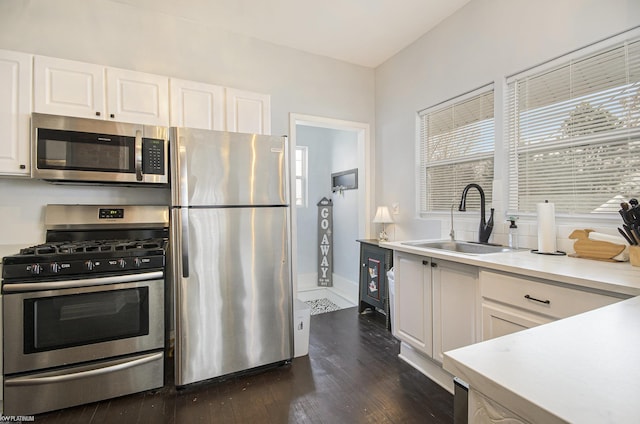 17315 Kershaw St, Roseville, MI 48066 - kitchen featuring stainless steel appliances, a sink, white cabinets, dark wood-style floors, and light countertops