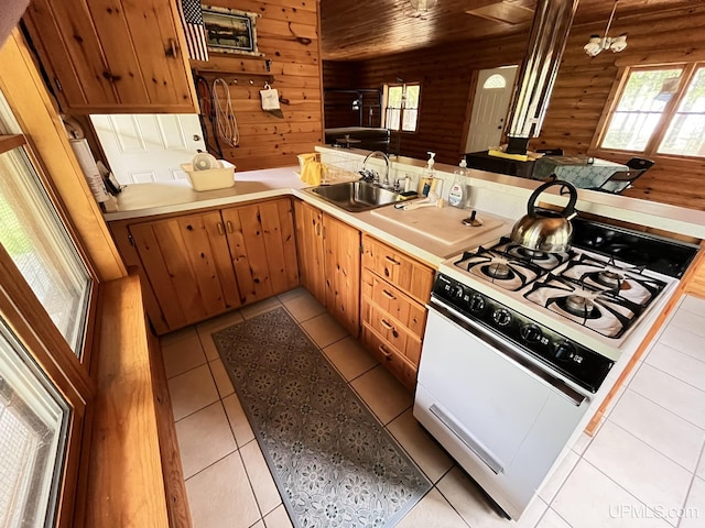 14520 7th Rd, Garden, MI 49835 - kitchen with white range with gas stovetop, a sink, plenty of natural light, light countertops, and wood ceiling
