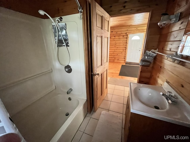 14520 7th Rd, Garden, MI 49835 - full bath with wooden walls, tile patterned floors, vanity, and shower / bath combination