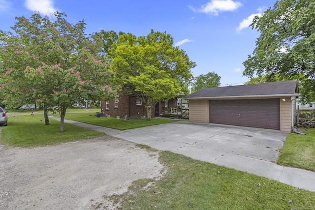 3106 Winifred St, Wayne, MI 48184 - view of front of property with a front lawn and a detached garage
