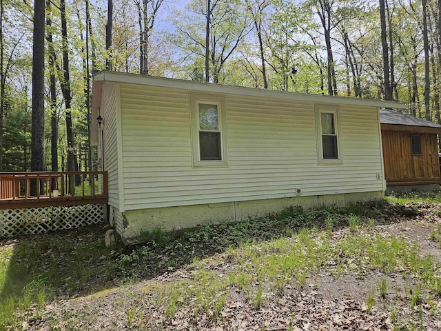 4949 Filter Rd, Harrison, MI 48625 - view of home's exterior featuring a wooden deck