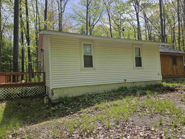 4949 Filter Rd, Harrison, MI 48625 - view of home's exterior featuring a wooden deck