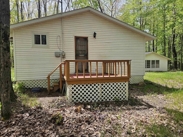 4949 Filter Rd, Harrison, MI 48625 - back of property with a deck