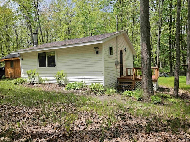 4949 Filter Rd, Harrison, MI 48625 - view of side of property featuring a wooden deck