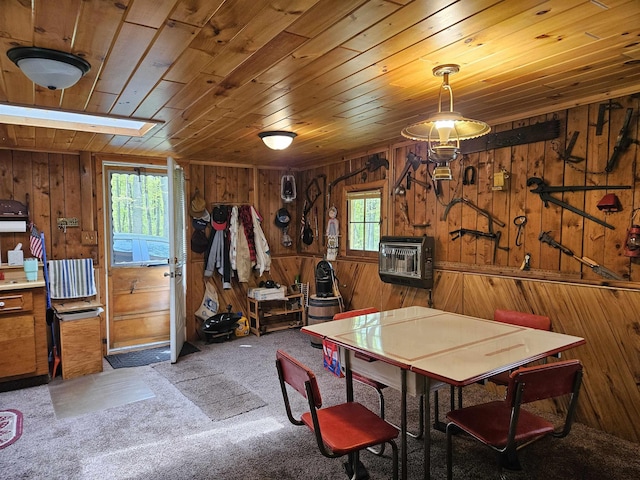 4949 Filter Rd, Harrison, MI 48625 - dining area featuring wooden walls, wooden ceiling, carpet flooring, and heating unit