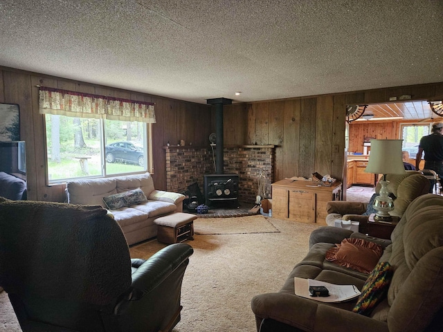 4949 Filter Rd, Harrison, MI 48625 - carpeted living area featuring wood walls, a textured ceiling, and a wood stove