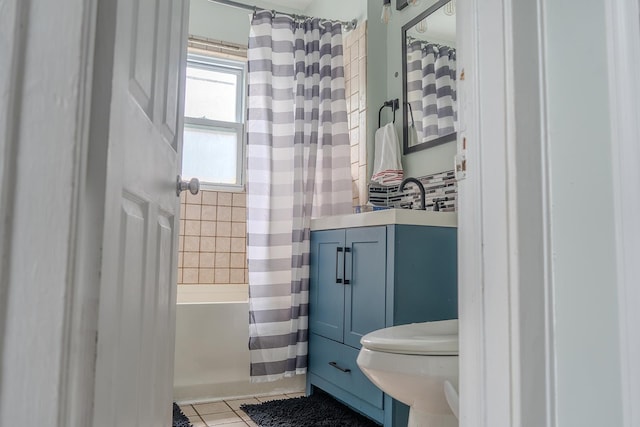 2129 N Clinton St, Saginaw, MI 48602 - bathroom featuring tile patterned flooring, toilet, and vanity