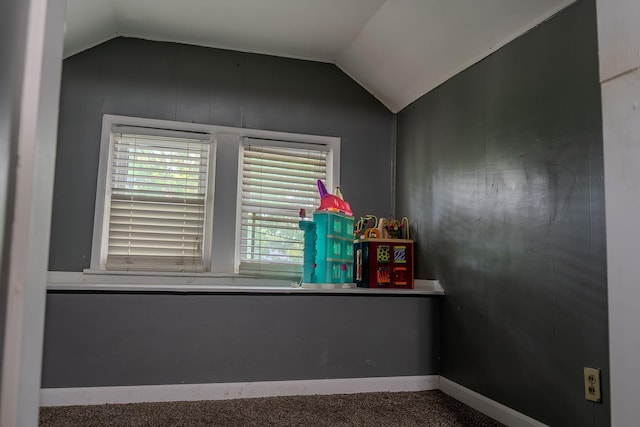 2129 N Clinton St, Saginaw, MI 48602 - empty room with vaulted ceiling, baseboards, and carpet floors