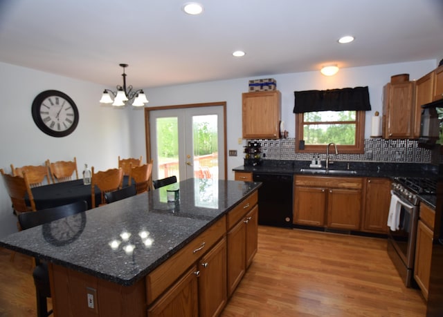 3850 Mando Ct, Coleman, MI 48611 - kitchen featuring dishwasher, gas range, a sink, healthy amount of natural light, and recessed lighting