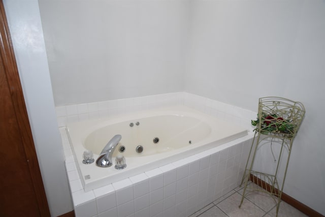 3850 Mando Ct, Coleman, MI 48611 - bathroom with a jetted tub and tile patterned floors