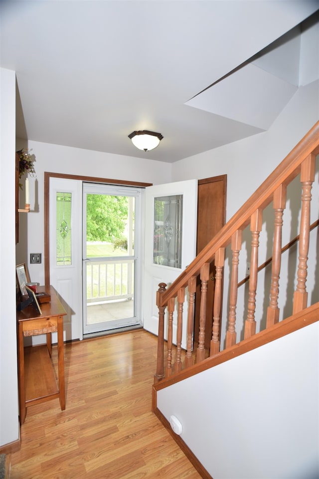 3850 Mando Ct, Coleman, MI 48611 - entrance foyer with light wood finished floors and stairs
