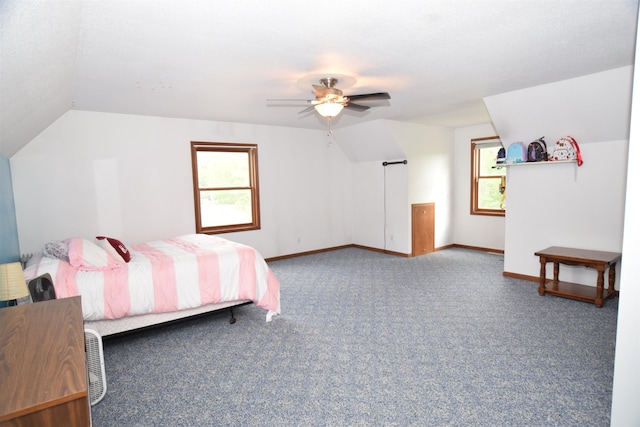 3850 Mando Ct, Coleman, MI 48611 - carpeted bedroom featuring lofted ceiling, multiple windows, baseboards, and a ceiling fan