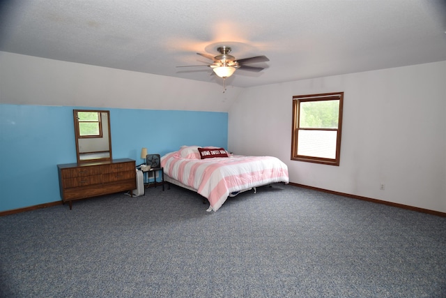 3850 Mando Ct, Coleman, MI 48611 - carpeted bedroom featuring multiple windows, baseboards, lofted ceiling, and a ceiling fan