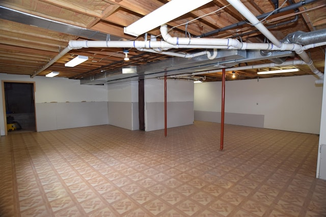 3850 Mando Ct, Coleman, MI 48611 - finished below grade area with light flooring
