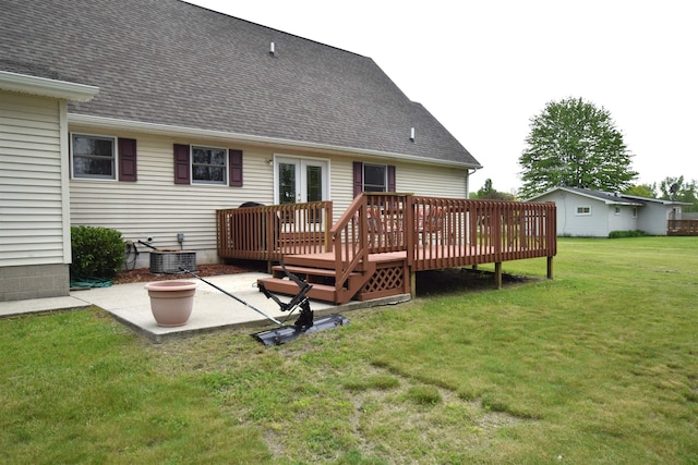 3850 Mando Ct, Coleman, MI 48611 - back of house with a patio, a wooden deck, cooling unit, a lawn, and french doors