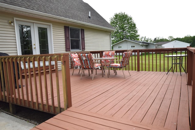 3850 Mando Ct, Coleman, MI 48611 - deck featuring outdoor dining area, french doors, and a lawn