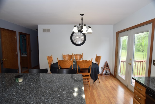 3850 Mando Ct, Coleman, MI 48611 - dining room with french doors, a chandelier, and light wood-style flooring