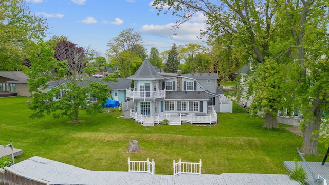 48816 Point Lakeview Dr, Chesterfield Twp, MI 48047 - back of property featuring a balcony and a wooden deck