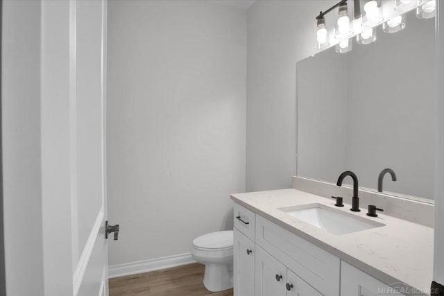 27621 Maryjane Ln E, Chesterfield Twp, MI 48047 - bathroom featuring vanity, wood finished floors, and toilet