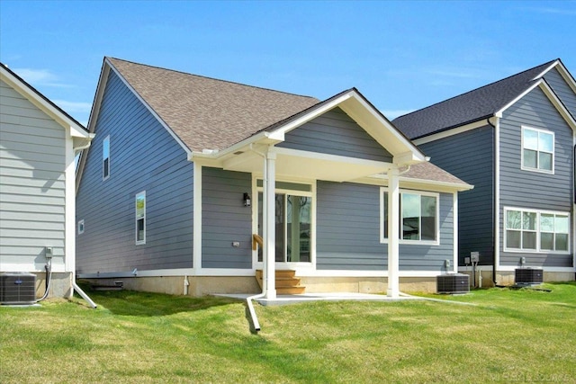 27621 Maryjane Ln E, Chesterfield Twp, MI 48047 - rear view of property with a lawn, cooling unit, and a shingled roof