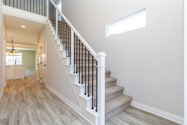 27633 Maryjane Ln E, Chesterfield Twp, MI 48047 - stairway featuring wood finished floors, baseboards, and recessed lighting