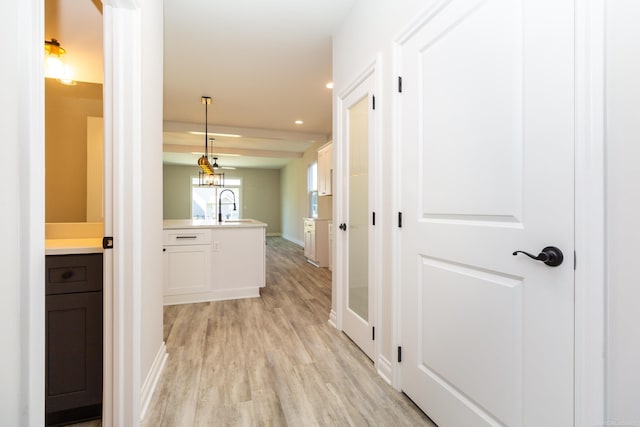 27633 Maryjane Ln E, Chesterfield Twp, MI 48047 - corridor featuring light wood finished floors, recessed lighting, a sink, and baseboards