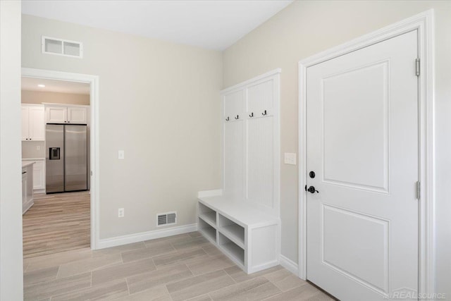 27633 Maryjane Ln E, Chesterfield Twp, MI 48047 - mudroom featuring baseboards and light wood-style flooring